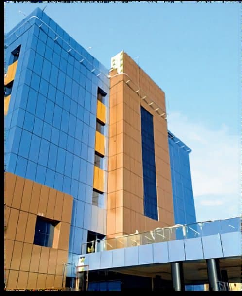 The corner of the hospital, where the glass meets the cladding