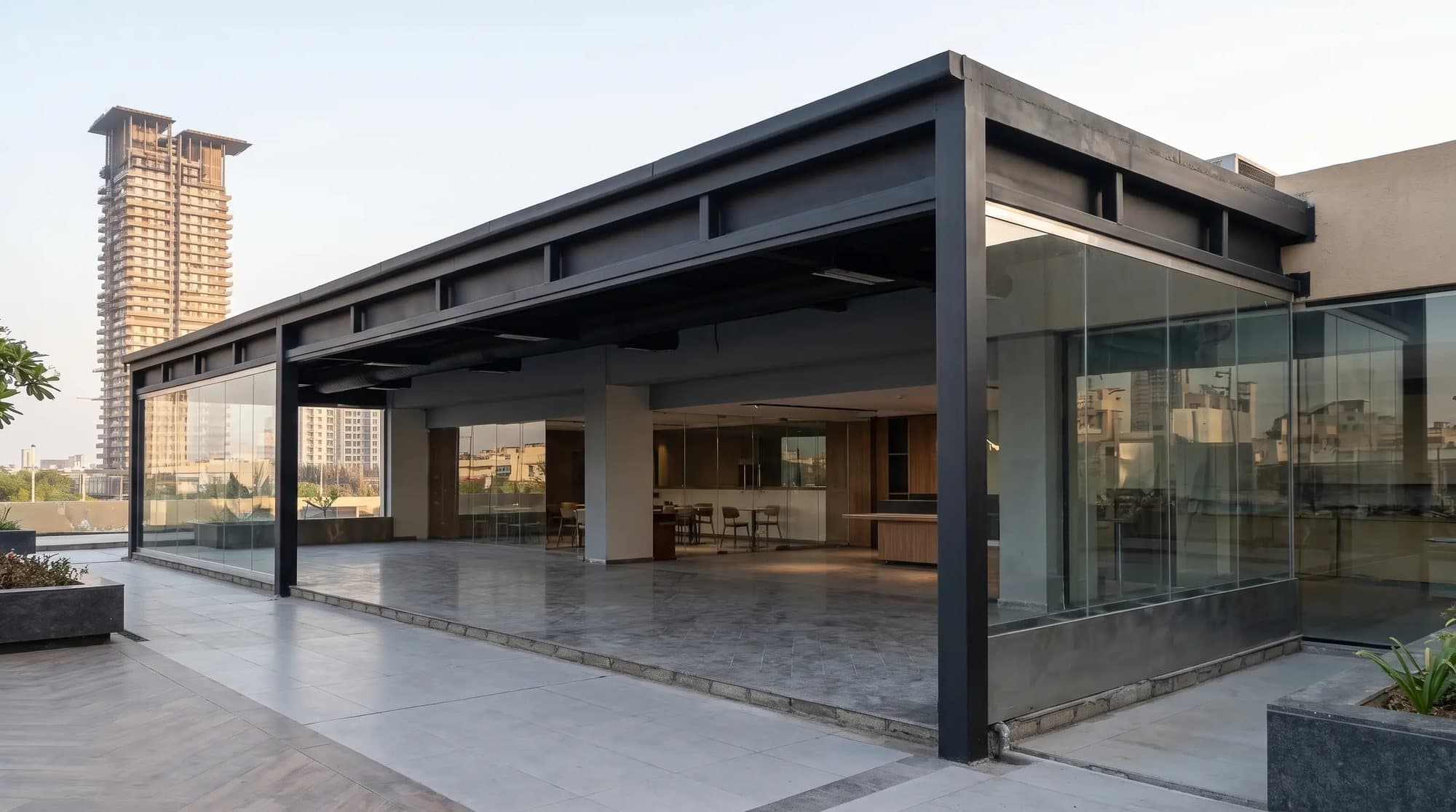 The black steel canopy at Al Yamama, with the tower behind